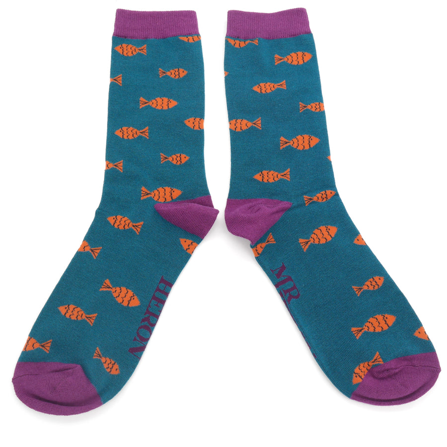 Teal socks with an orange fish pattern and purple cuffs.