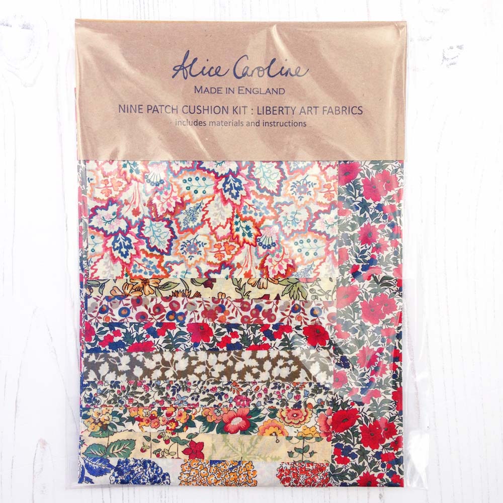 Nine-patch cushion kit featuring Liberty Art Fabrics; includes materials and instructions.
