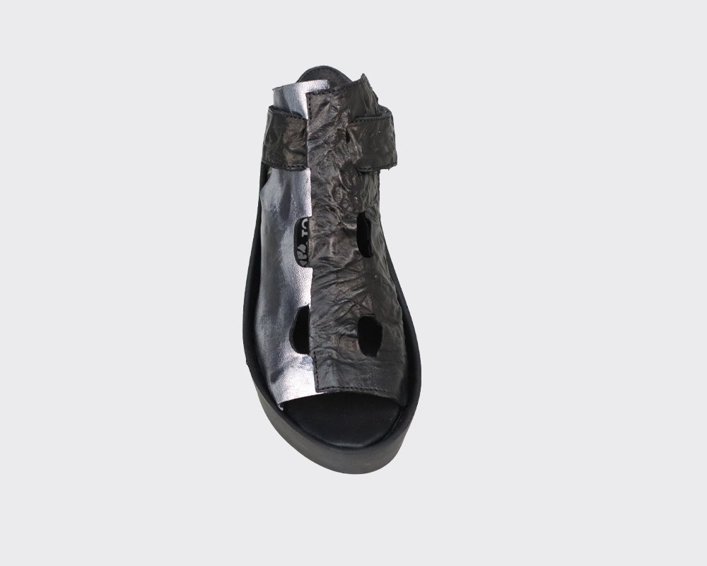 Black and silver leather platform sandal with cut-out detailing and ankle strap.