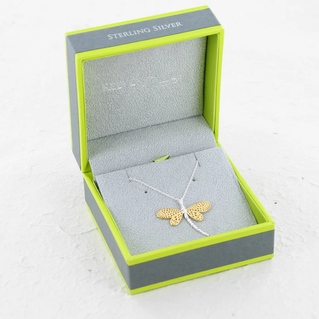 Sterling silver dragonfly necklace with gold-tone detailing, displayed in a lime green and grey gift box.
