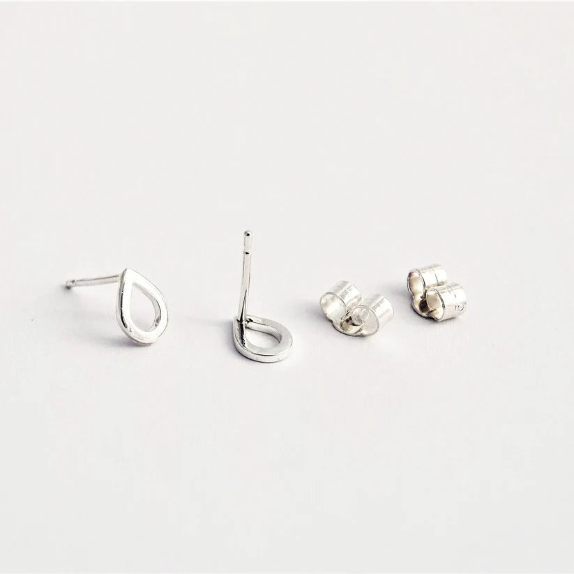 Pair of silver teardrop stud earrings with open design.  Includes butterfly backs.