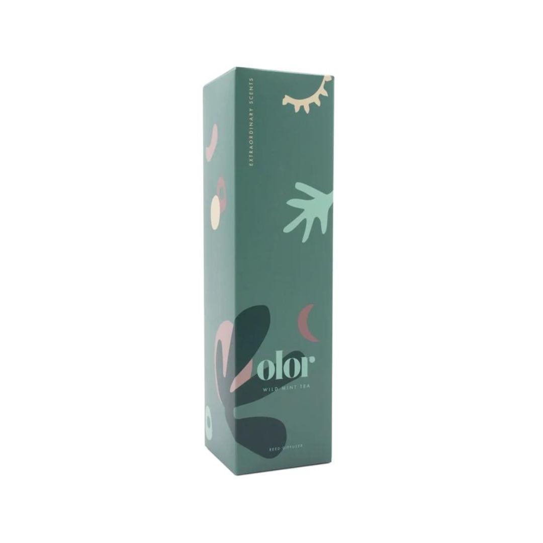 Green reed diffuser box featuring abstract foliage and celestial designs.  "olor" logo and "Wild Mint Tea" text are visible.
