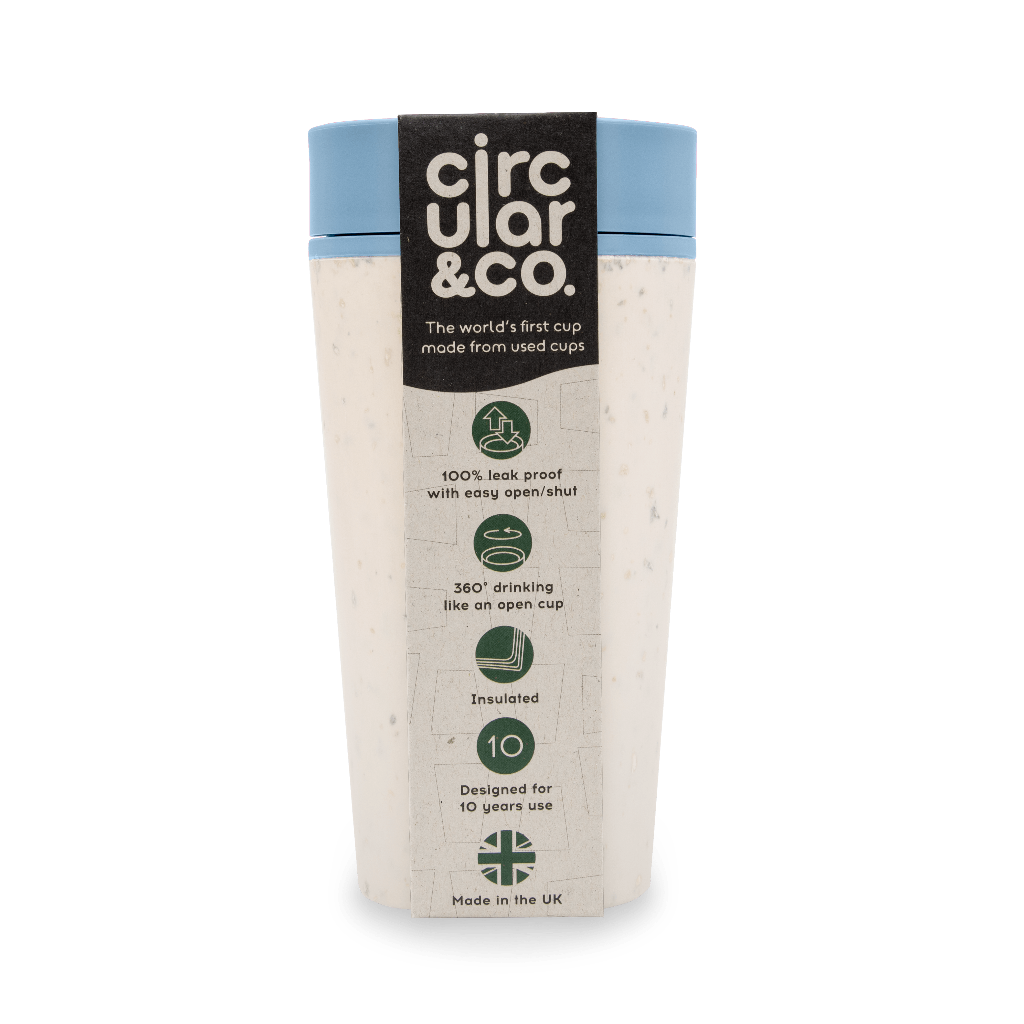 Off-white reusable travel cup with light blue lid, made from recycled cups.