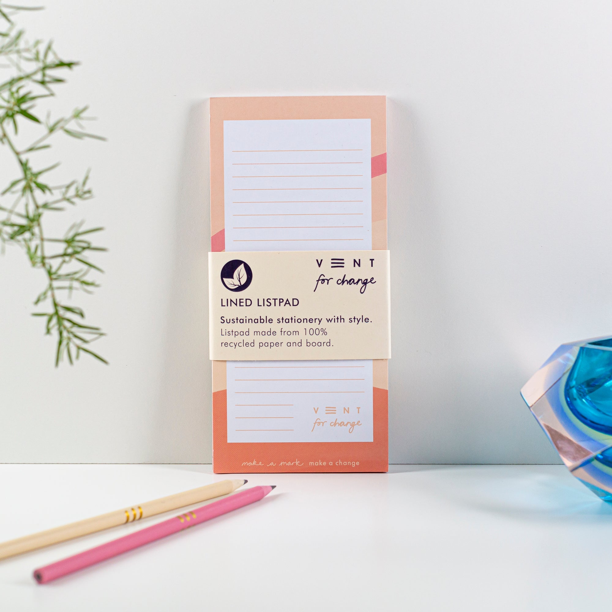 Peach-colored lined listpad made from 100% recycled paper and board.