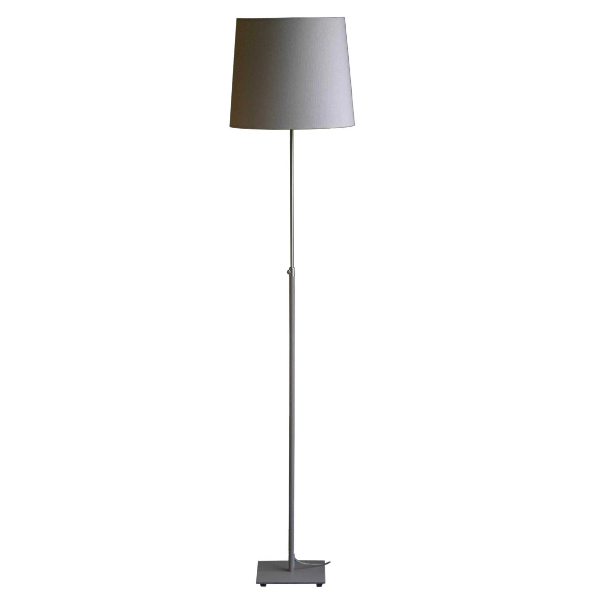 Modern floor lamp with a light gray fabric shade and a tall, slender gray metal base.