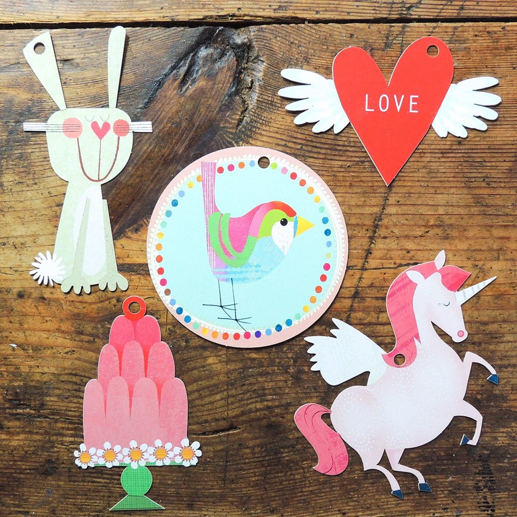 Assortment of illustrated gift tags: rabbit, bird, heart with wings, unicorn, and cake.