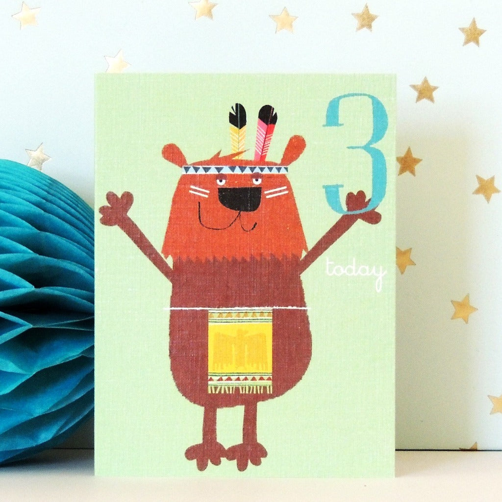 Third birthday card featuring a cartoon bear wearing a Native American-inspired headdress and sash.