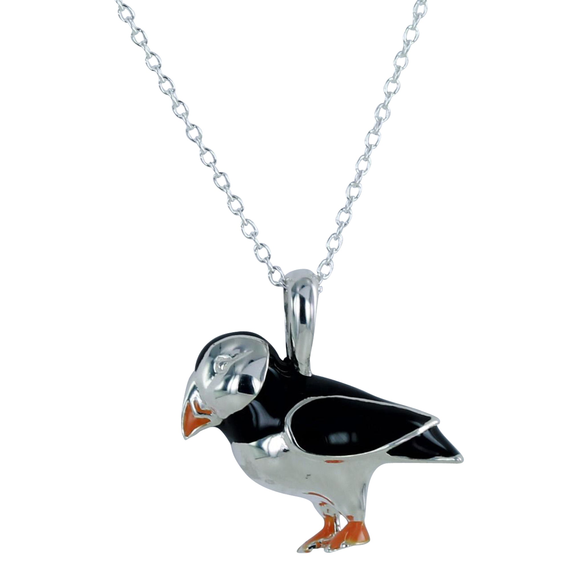 Silver chain necklace with a black and silver puffin pendant.  The puffin features orange detailing on its beak and feet.