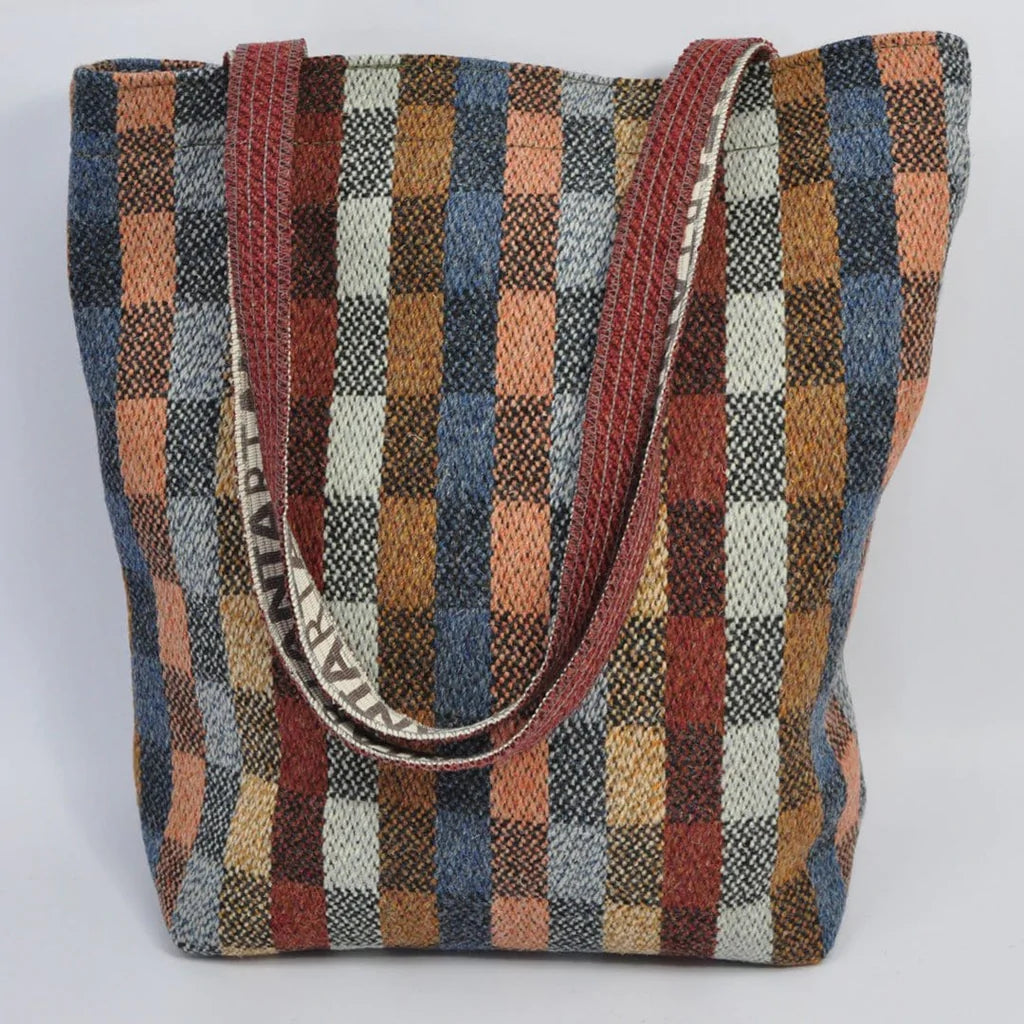 Large tote bag with red and beige plaid pattern and maroon shoulder straps.