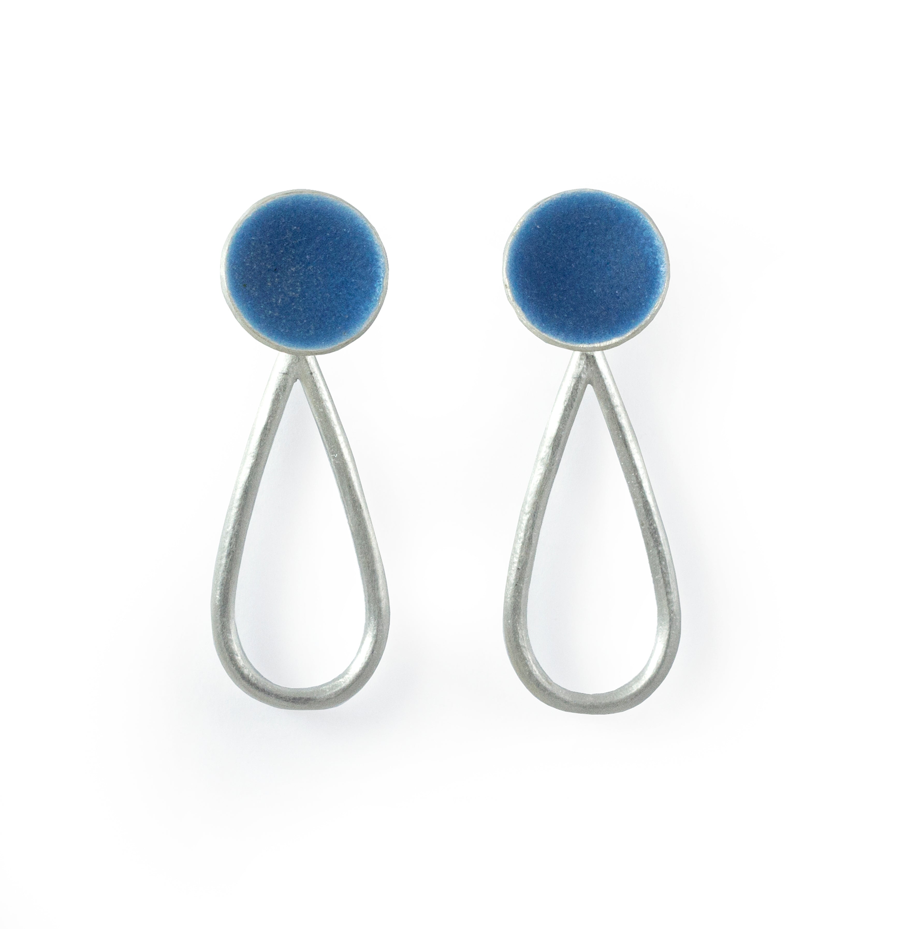 Pair of silver teardrop earrings with round, dark blue enamel accents.