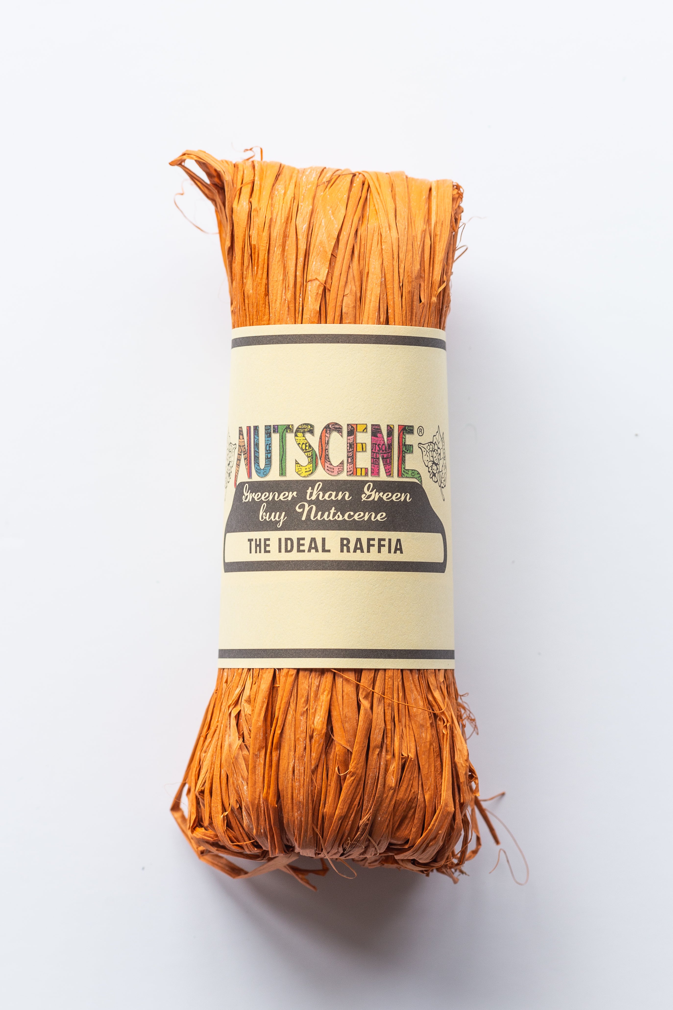 Orange raffia roll labeled "Nutscene," "Greener than Green buy Nutscene," and "The Ideal Raffia."
