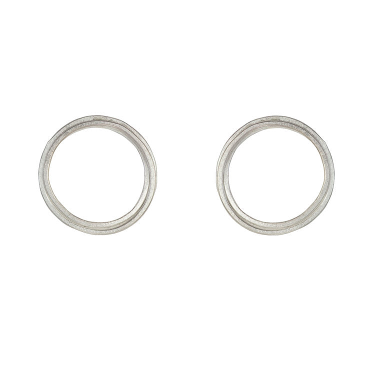 Pair of silver double-circle stud earrings.