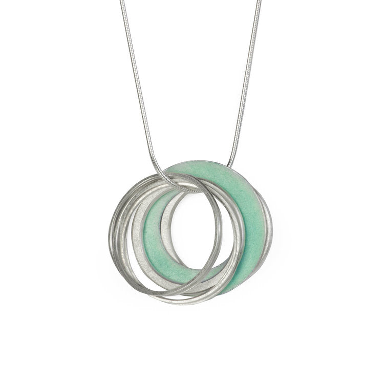 Silver necklace featuring a pendant of interlocked rings with pale green enamel.