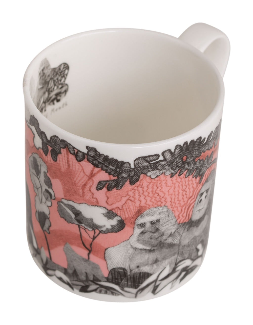 White mug with a pink and gray illustration of gorillas in a forest scene.