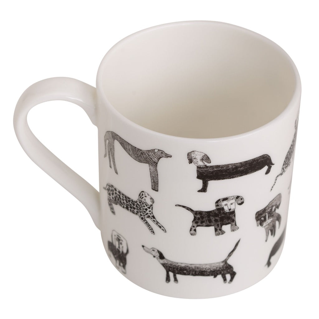 White mug featuring a pattern of black and white illustrated dogs of various breeds.