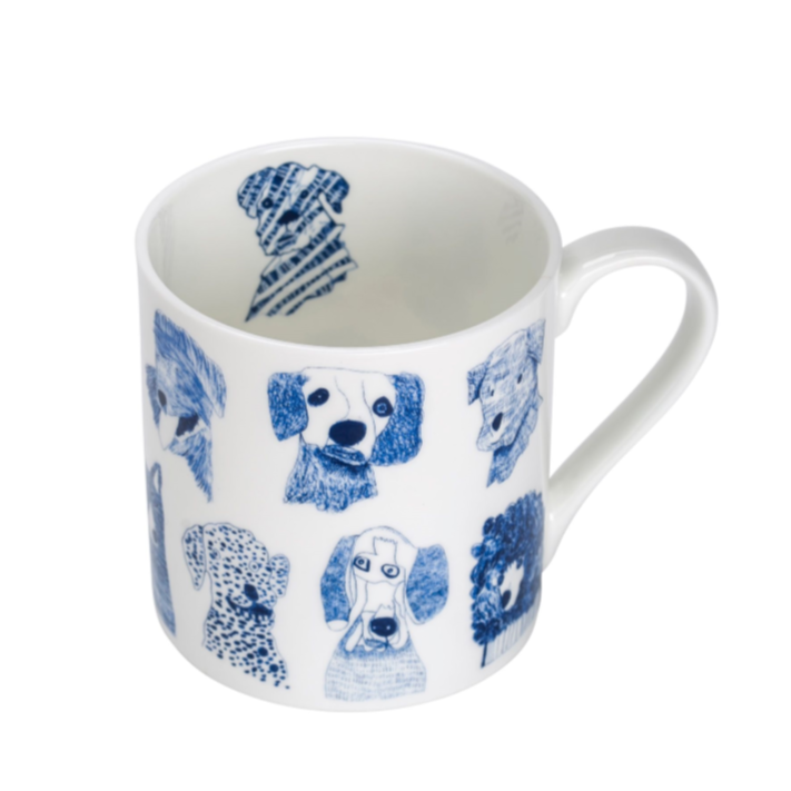 White mug featuring a pattern of blue and white dog illustrations.