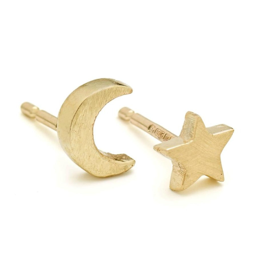Gold crescent moon and star stud earrings.  The brushed gold finish gives a matte texture.