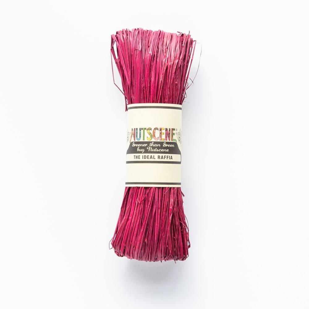 Crimson-colored raffia bundle labeled "Nutsceene The Ideal Raffia."