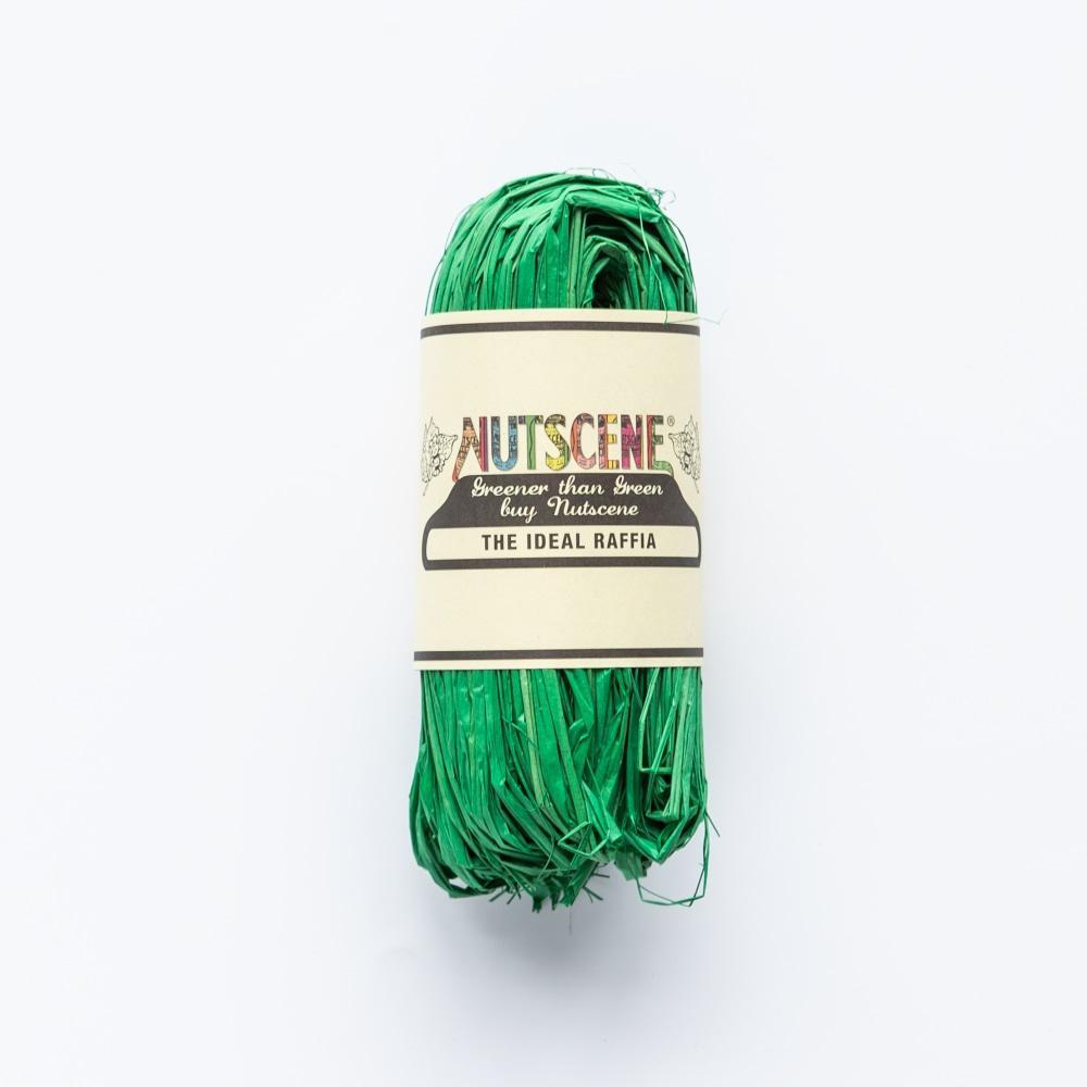 Roll of bright green raffia labeled "Nutsceene: The Ideal Raffia".