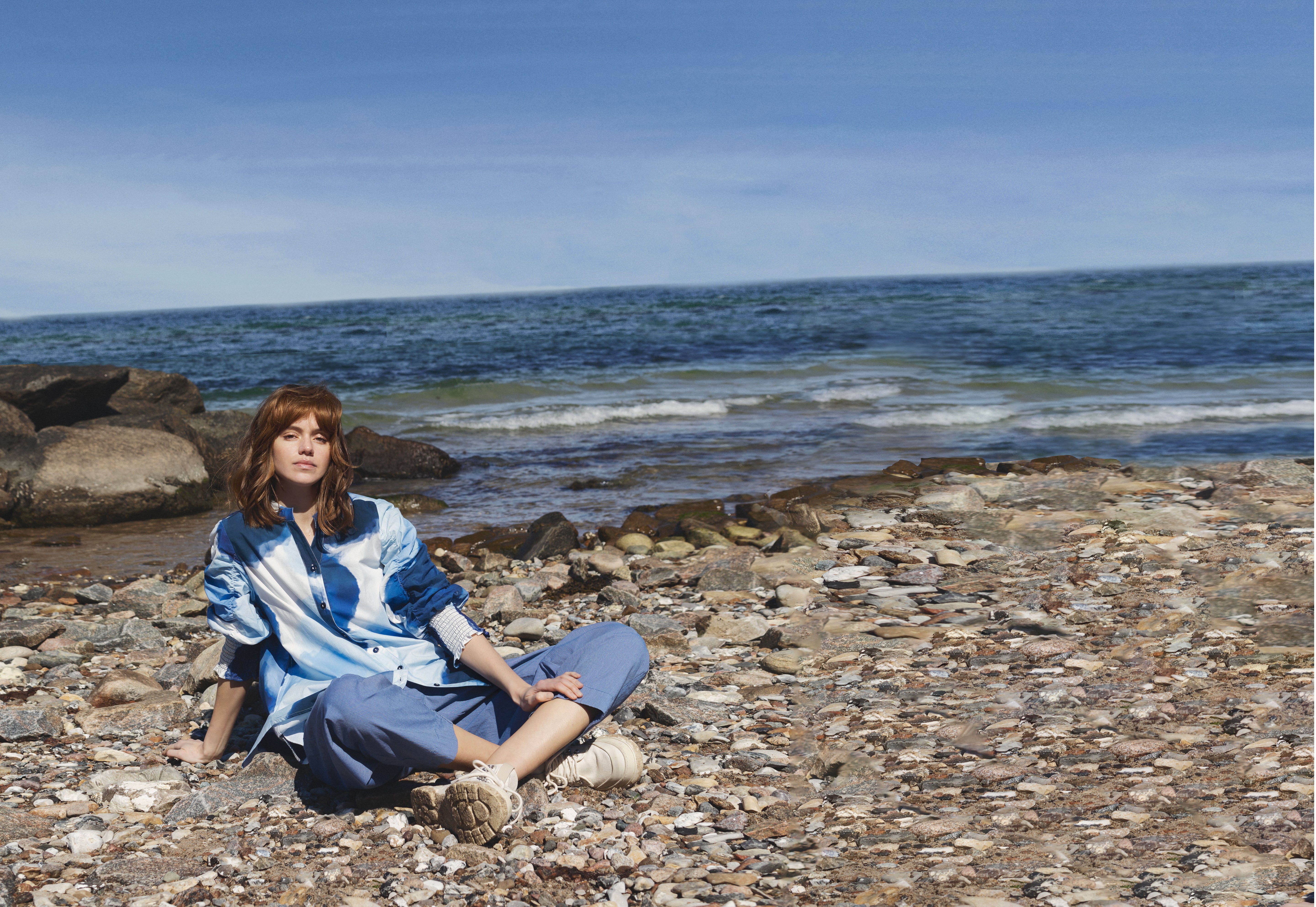 Women dressed in noen clothing in a beach background