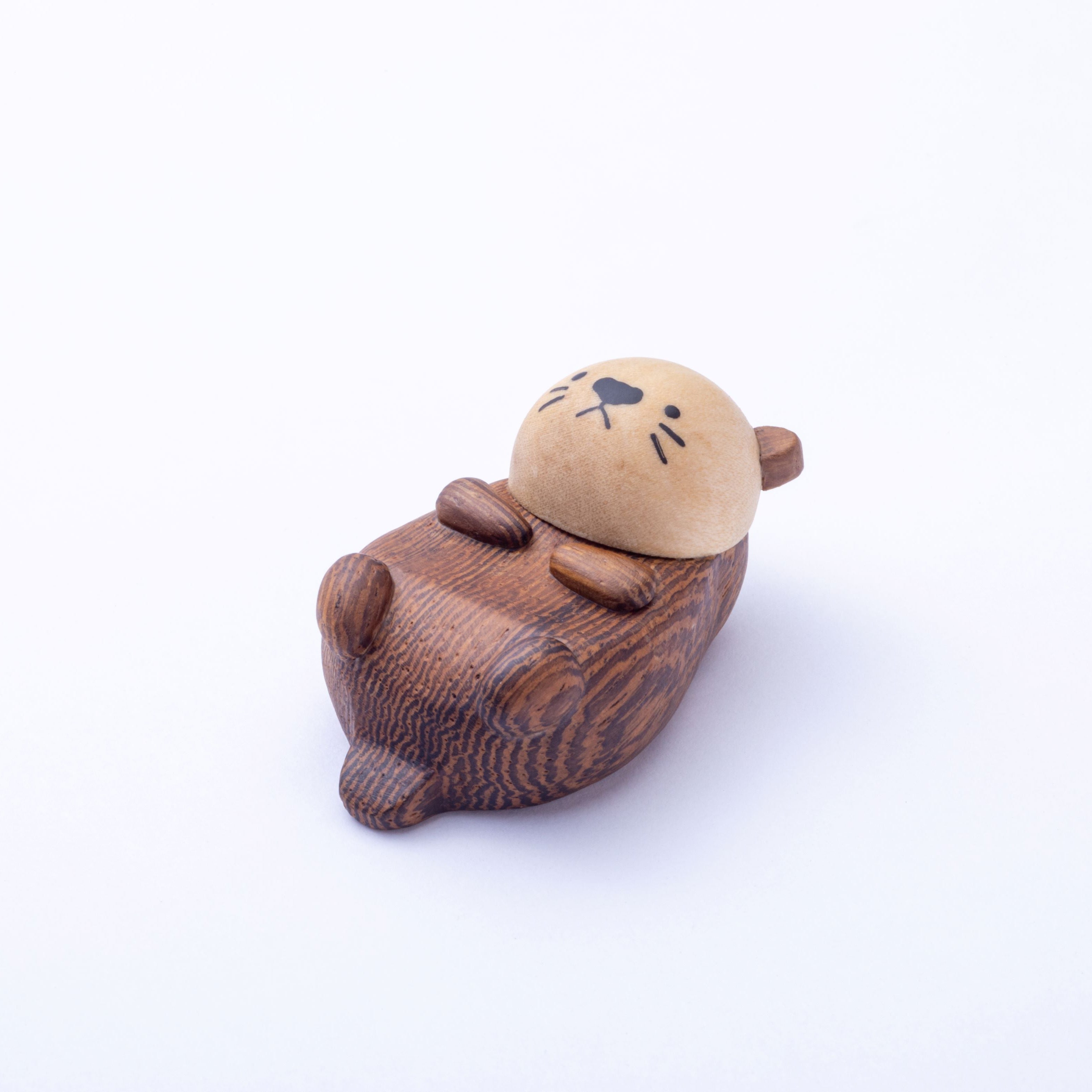 Small brown animal figurine on a white background