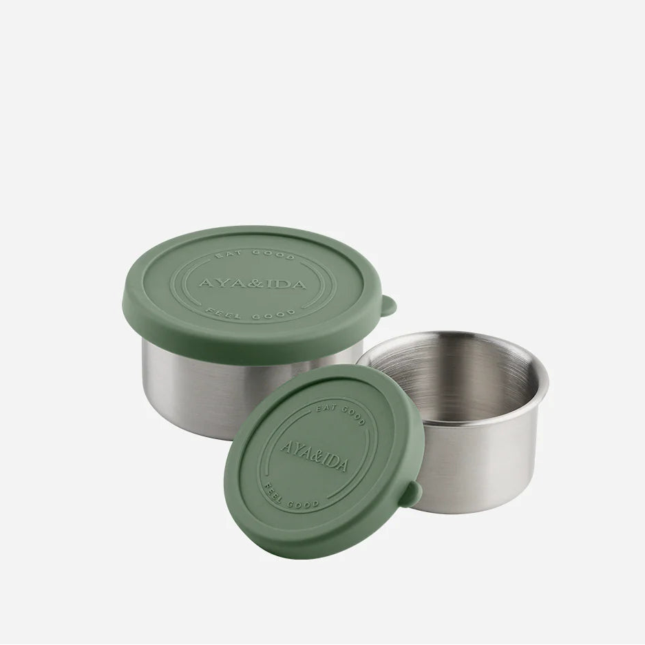Two stainless steel containers with green lids on a white background