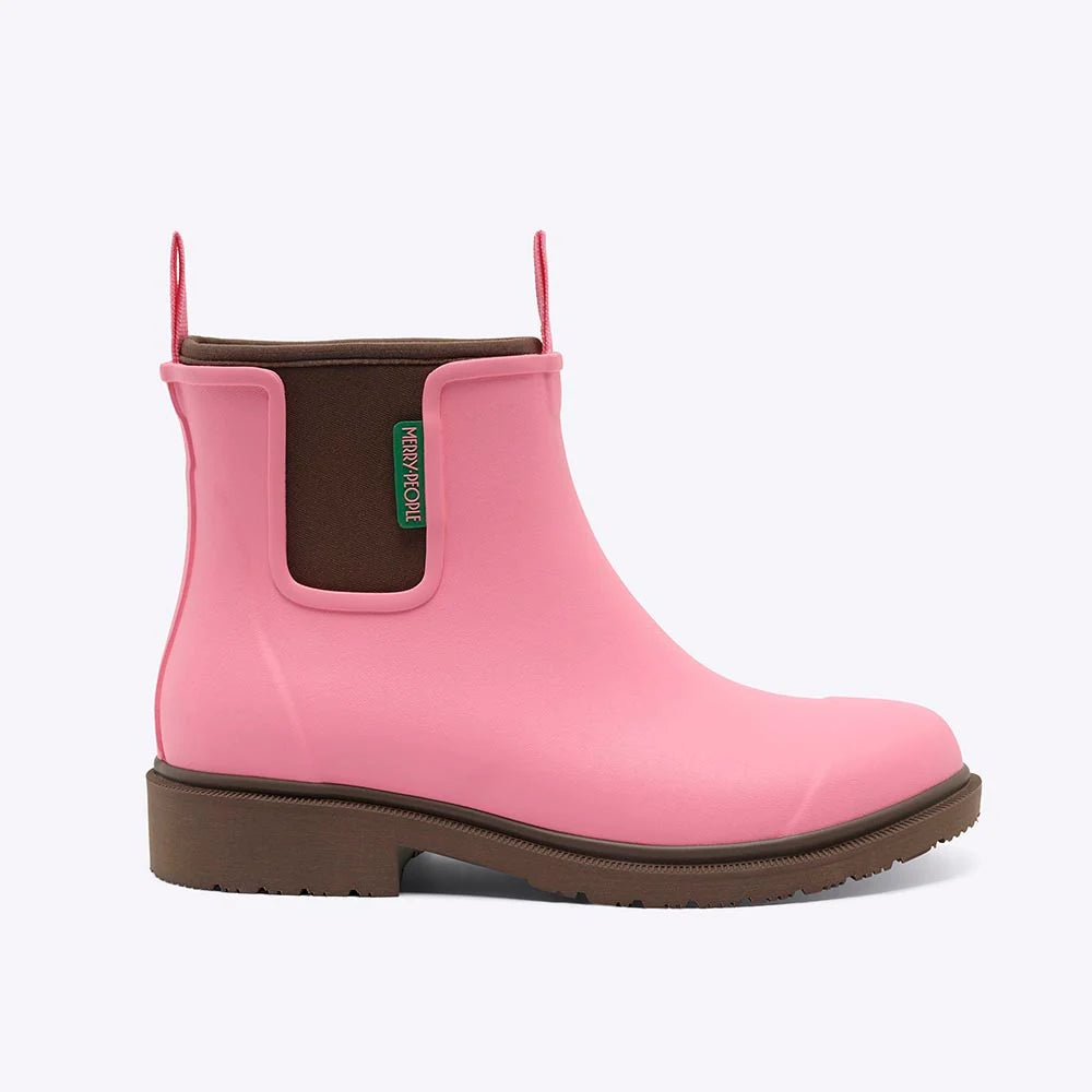 A pink rubber rain boot with a brown sole and a brown elastic side panel featuring a green 'PLAYBOY' brand tag, shown against a plain white background.
