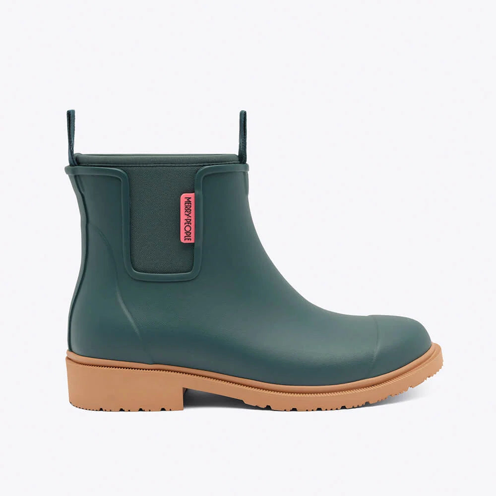 Green rain boot with a brown sole on a white background