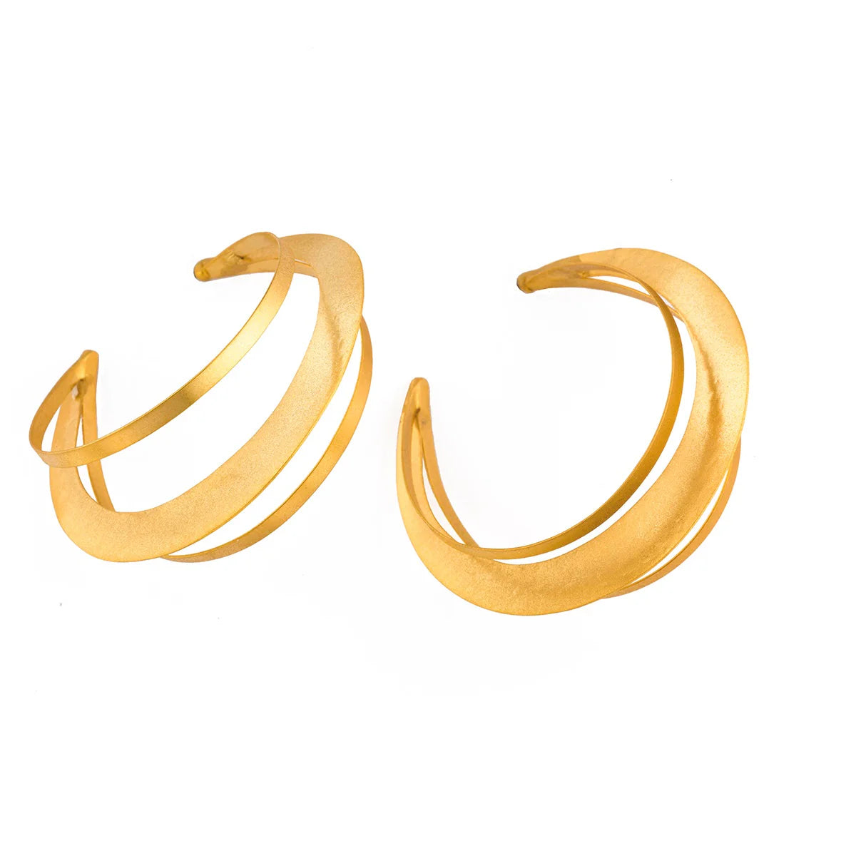 Gold hoop earrings on a white background