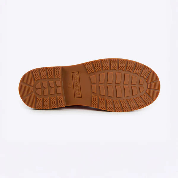 Brown sole of a shoe on a white background