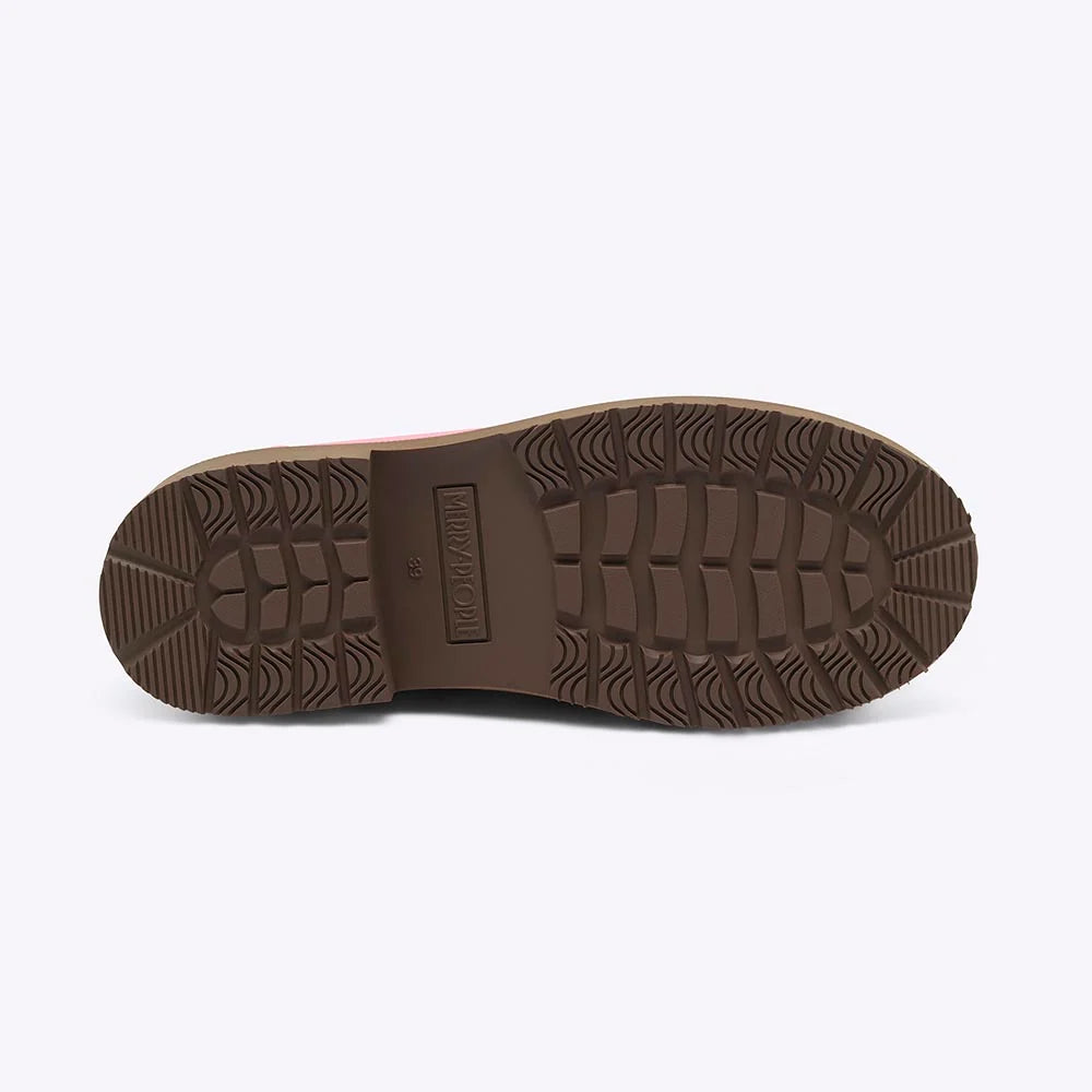 Black shoe sole with brand logo on a light gray background