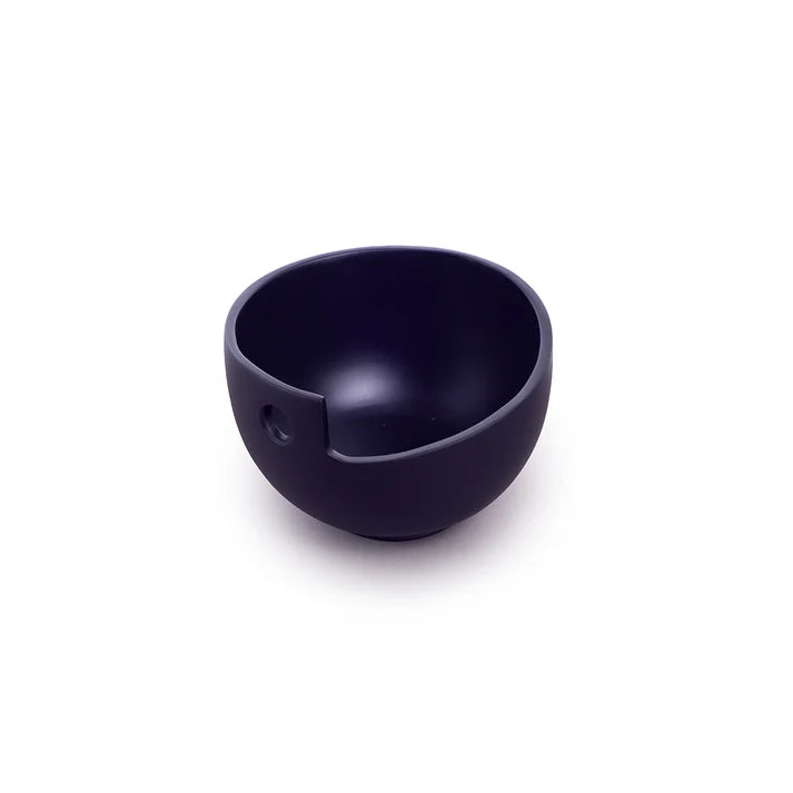 Dark purple yarn bowl with a cutout.