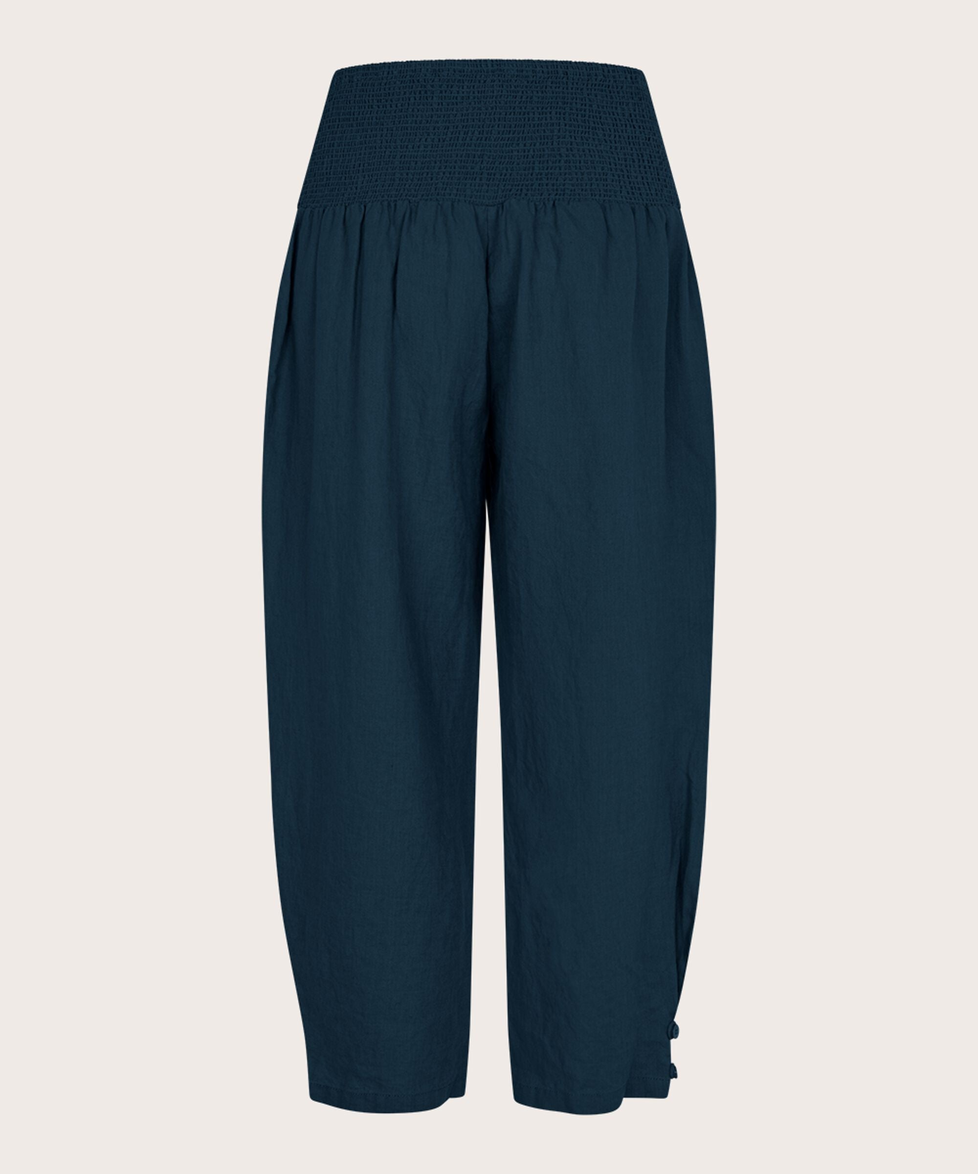 Navy blue wide-leg pants on a beige background