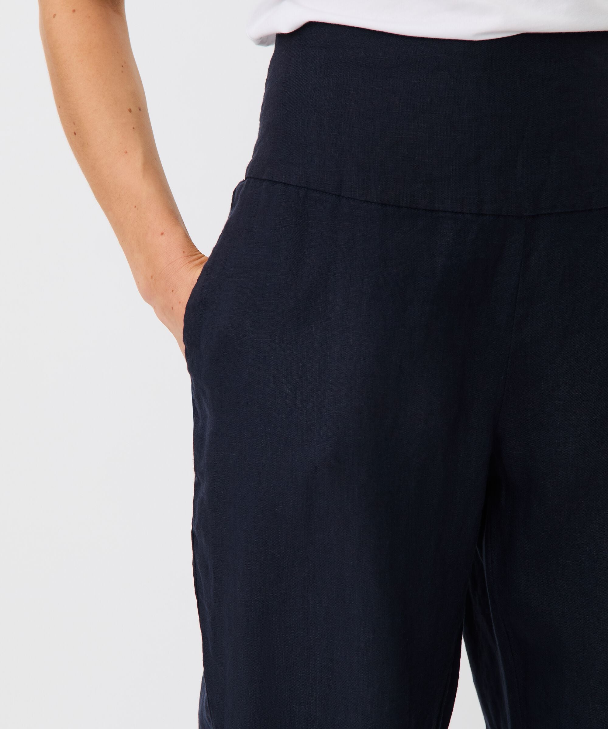 Navy blue pants on a plain background