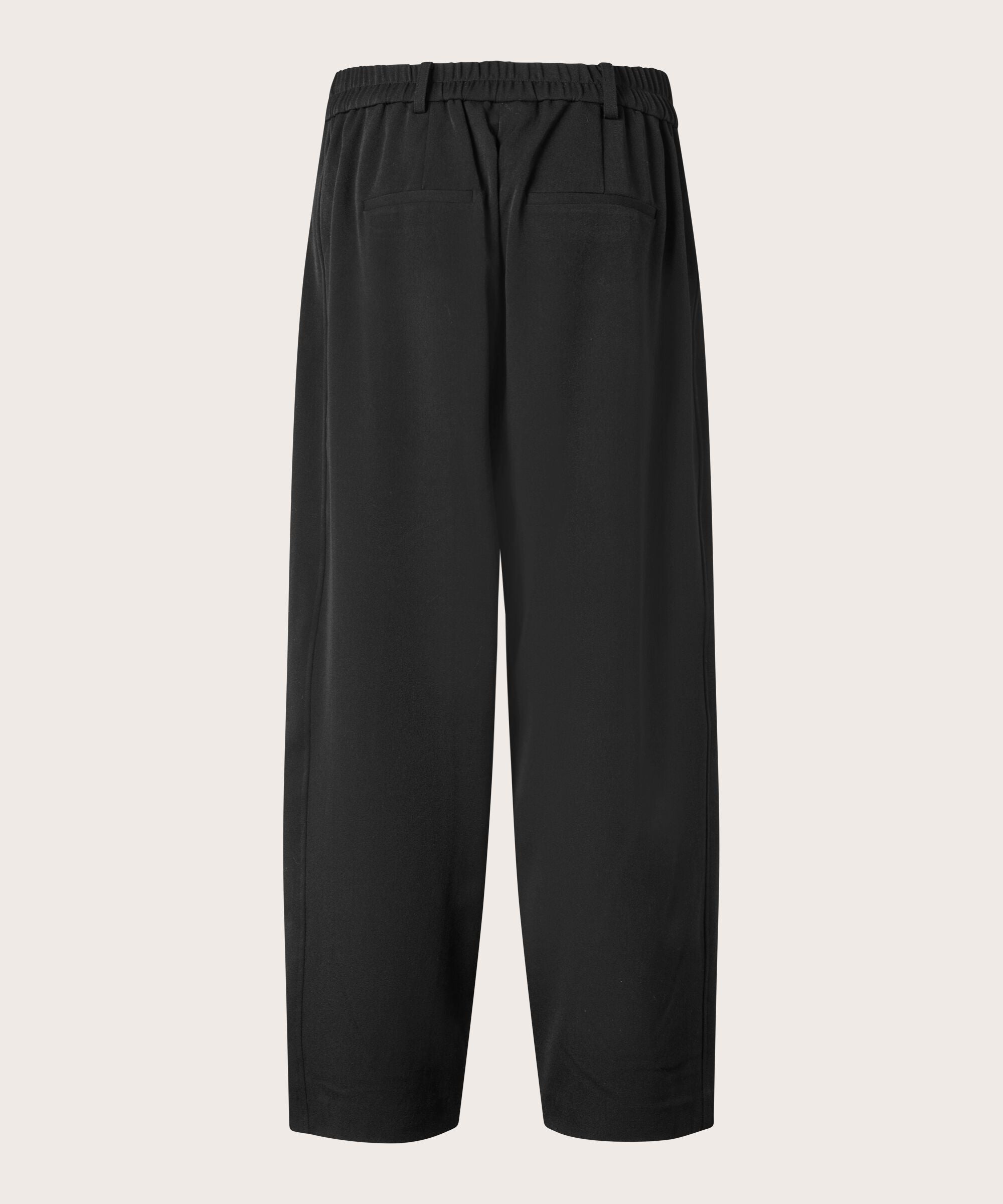 Black pants on a light gray background