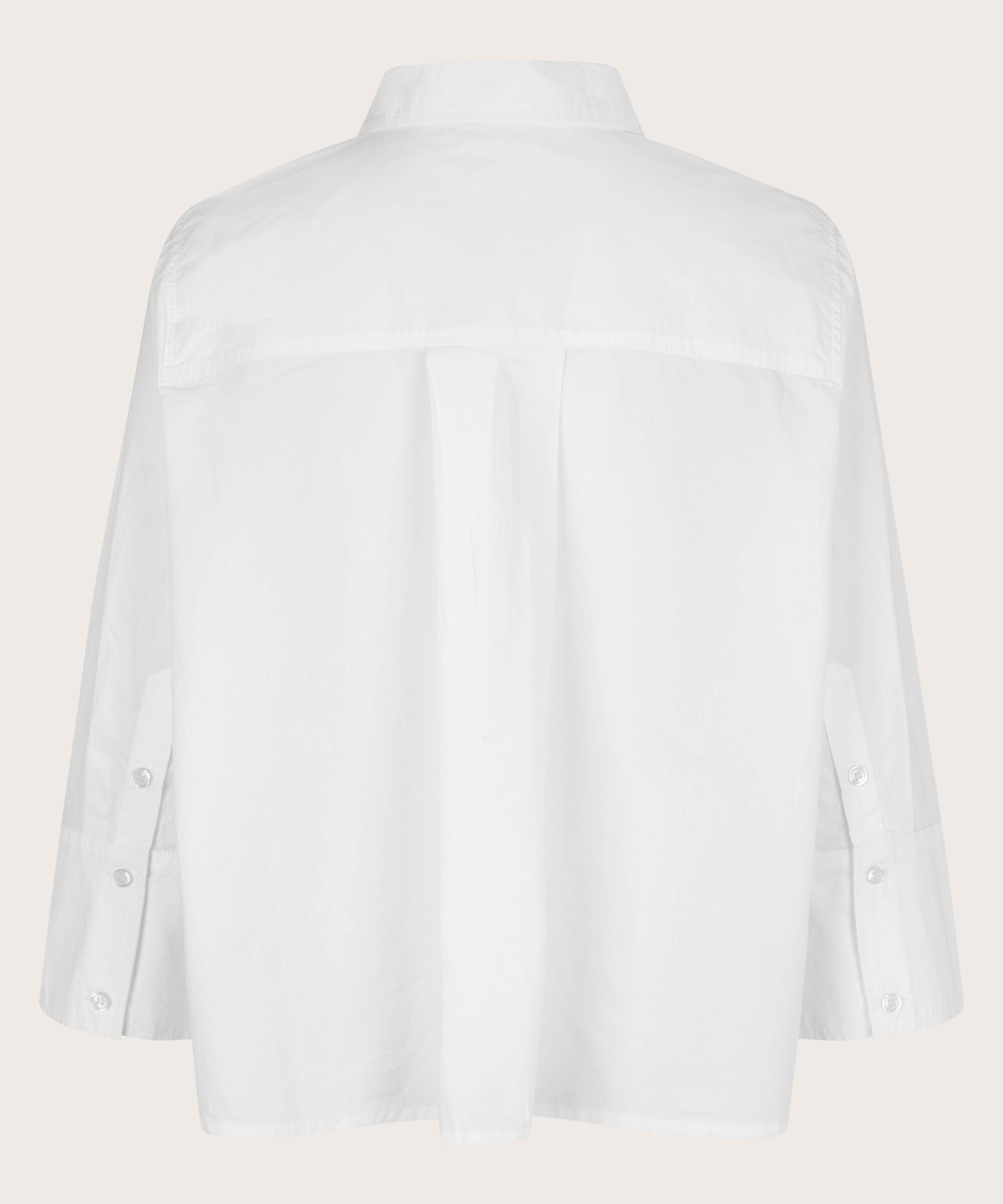White shirt on a light pink background