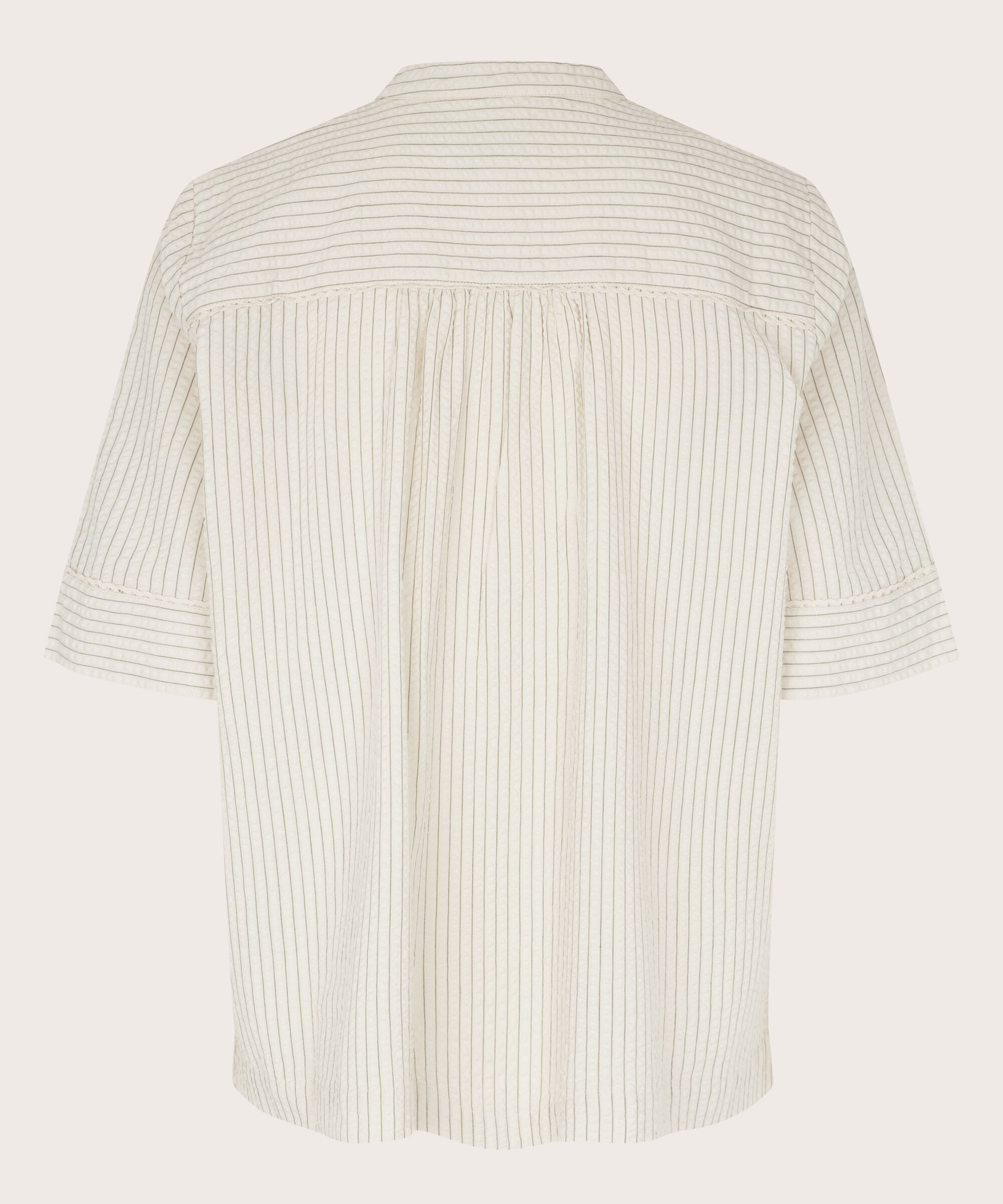 White striped shirt on a light gray background