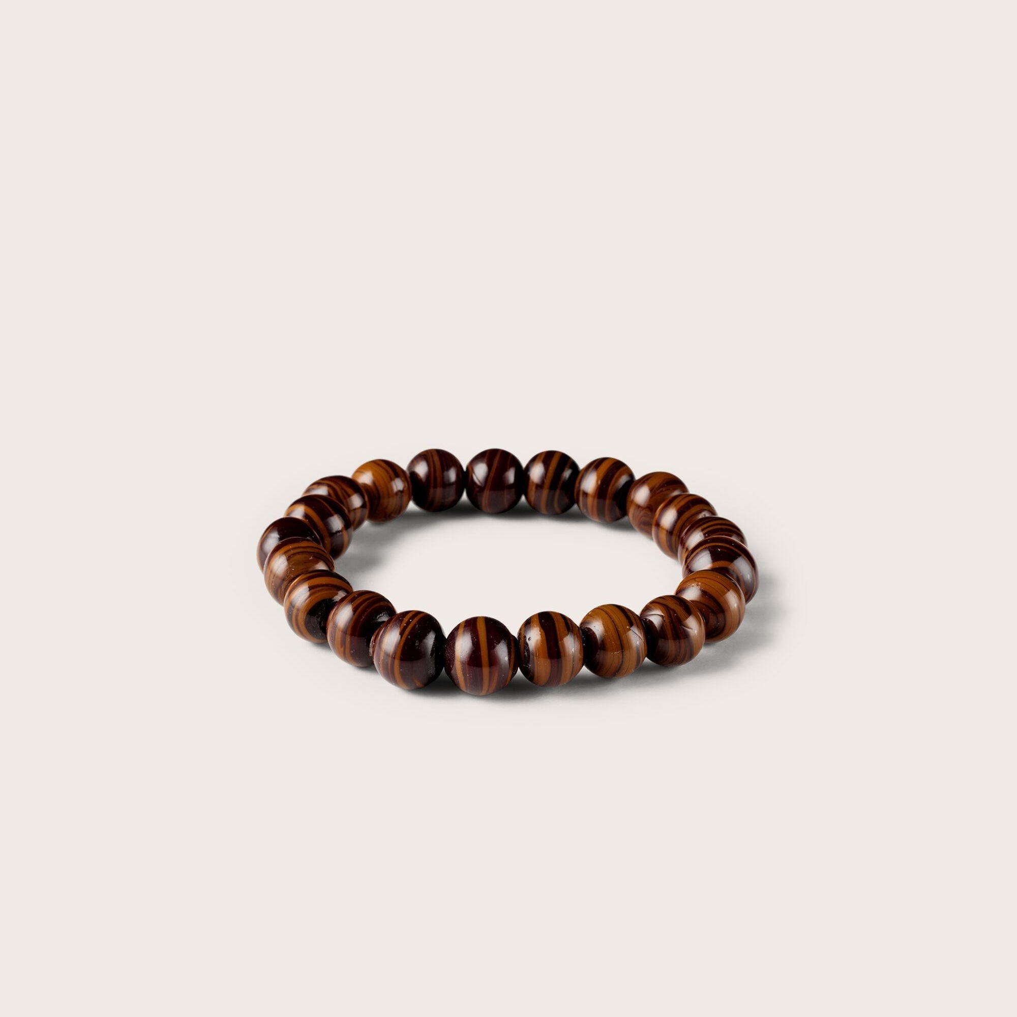 Wooden beaded bracelet on a beige background