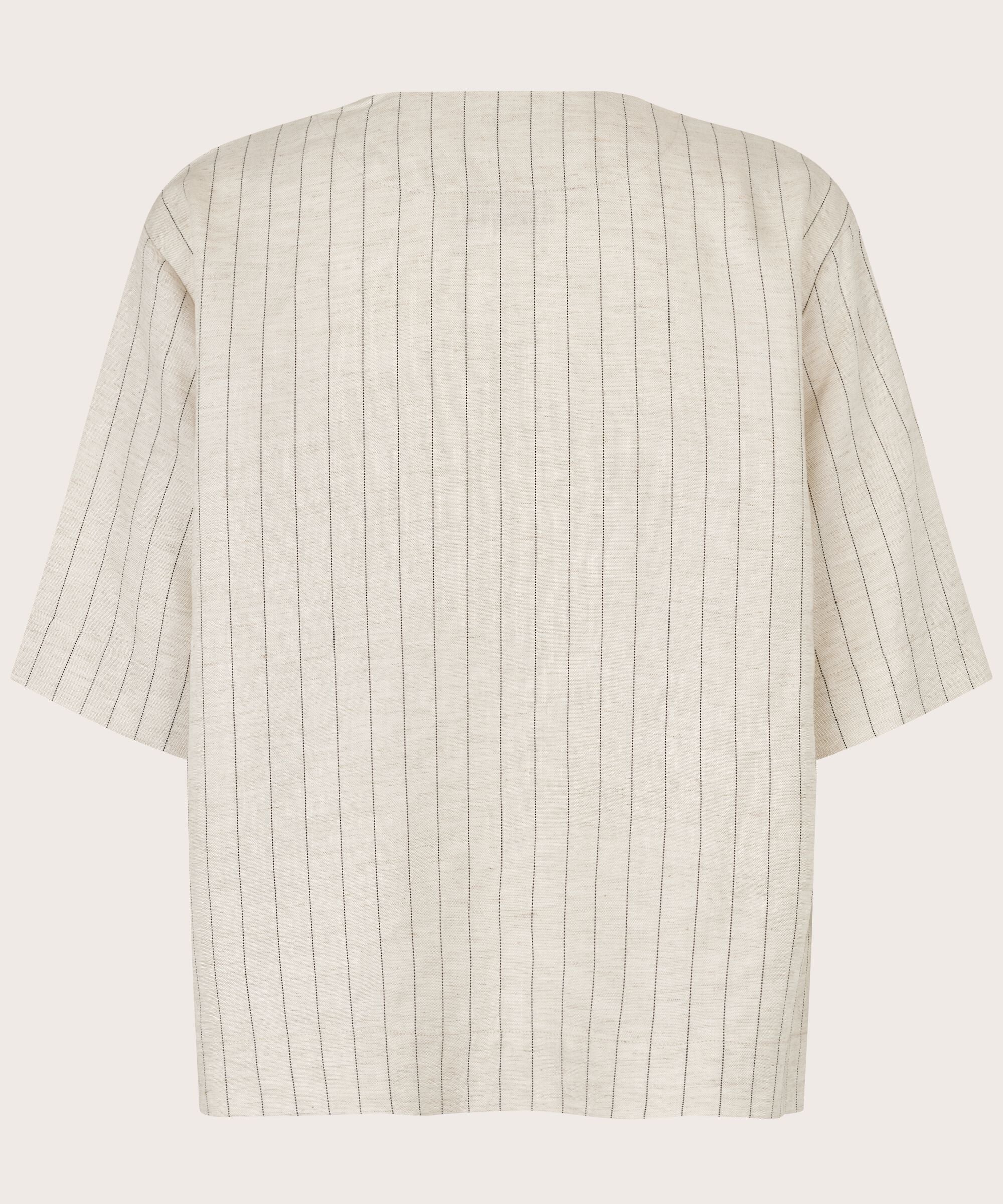 Beige and white striped shirt on a light gray background