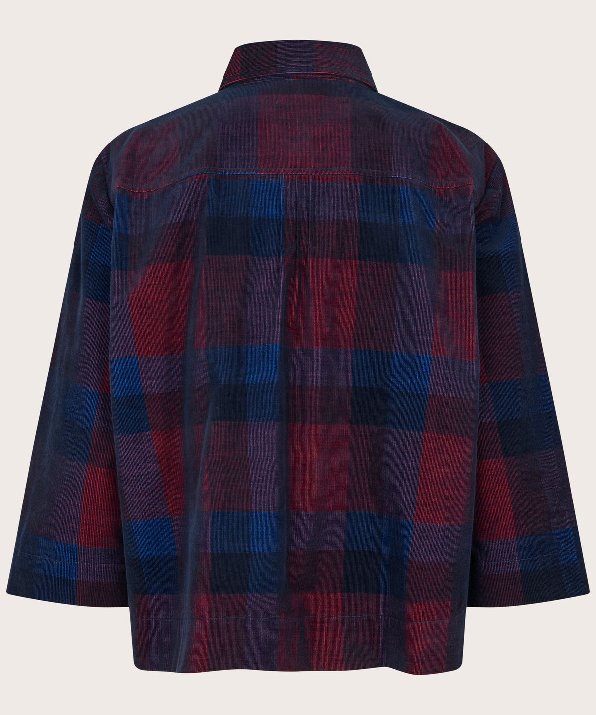 A long-sleeve plaid shirt shown from the back, featuring a pattern of dark blue, burgundy red, and black. The shirt has a collar and is displayed against a solid off-white background.