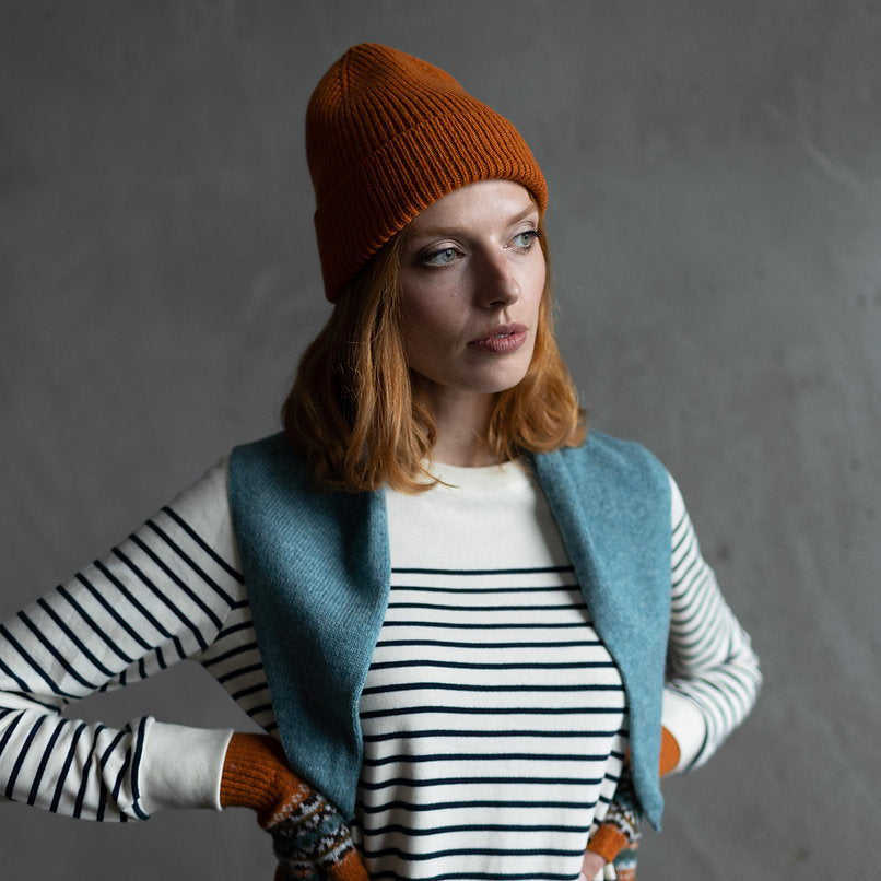 Burnt orange ribbed knit beanie.