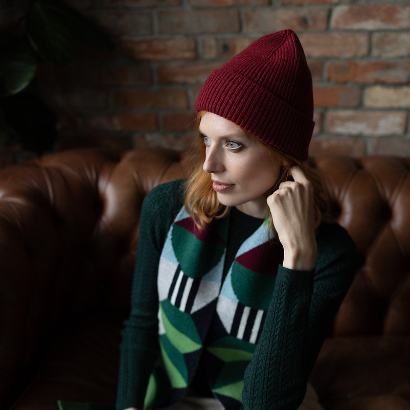 Red ribbed knit beanie.