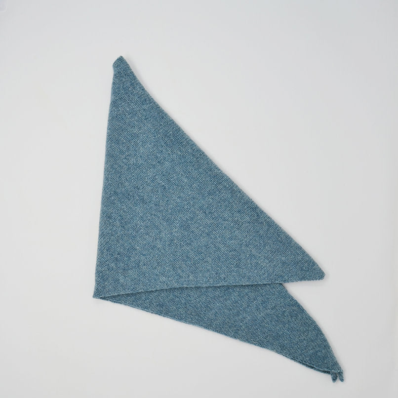 A light blue, triangular knit scarf folded in half.