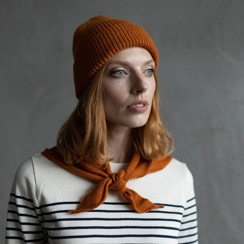 Burnt orange ribbed knit beanie.
