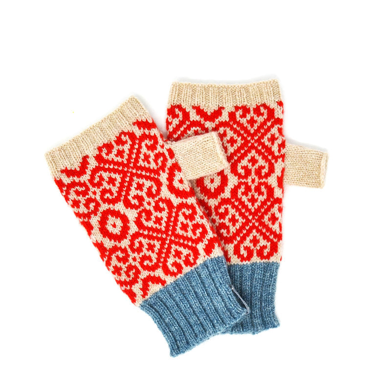 Pair of knitted fingerless gloves with red and beige geometric pattern and blue cuffs.