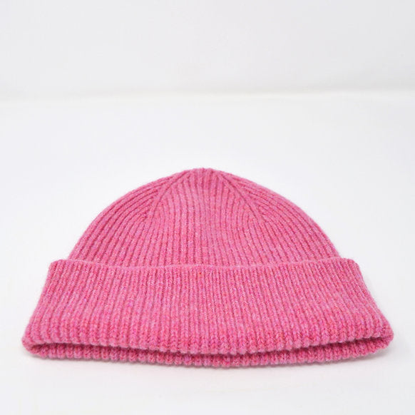 Pink ribbed knit beanie.