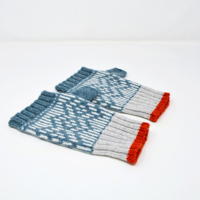 Pair of teal and gray fingerless gloves with a geometric pattern and orange cuffs.