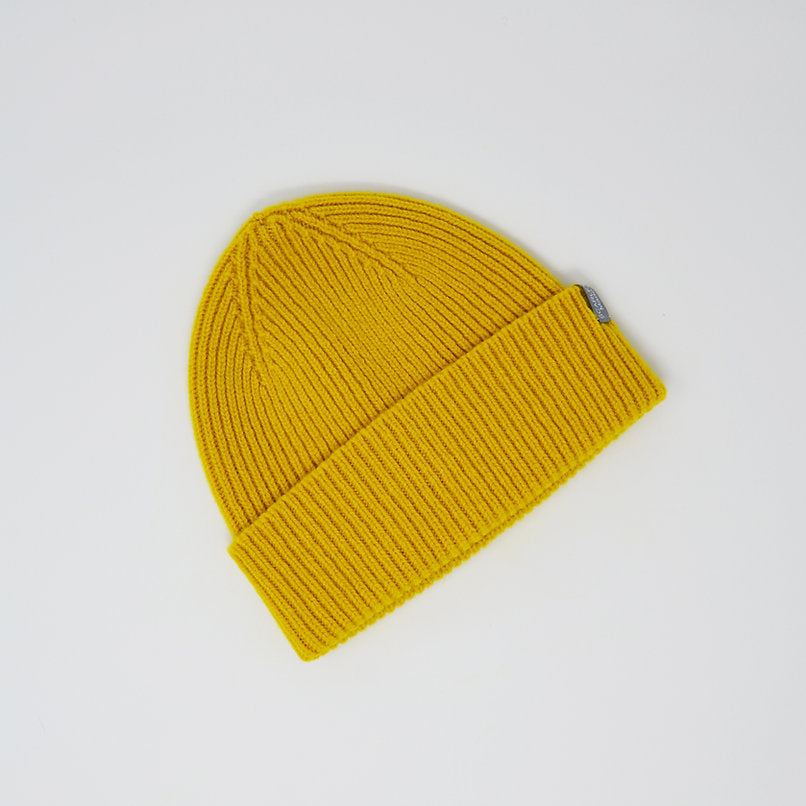 Mustard yellow ribbed knit beanie.