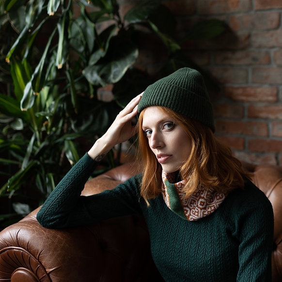 Dark green ribbed knit beanie.