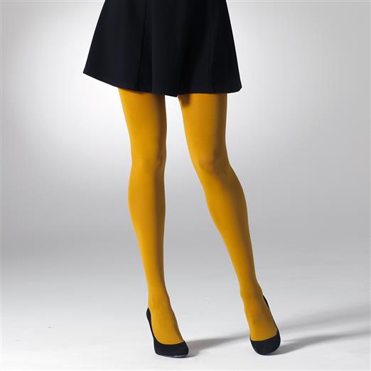 Mustard yellow opaque tights on a woman's legs, shown from knees down.